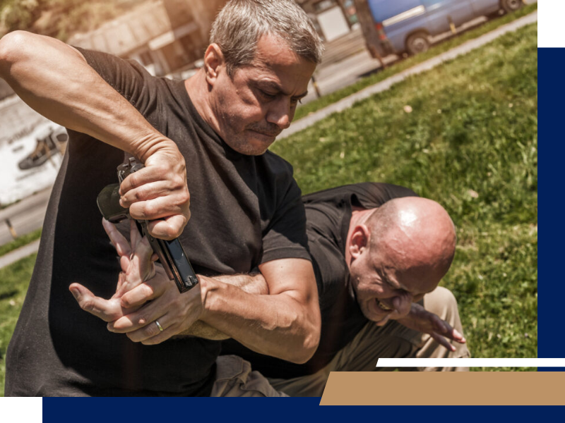 A person removing a gun from another person’s hands