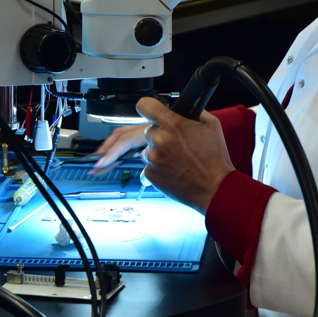 professional-data-recovery-services A person providing professional data recovery services using equipment