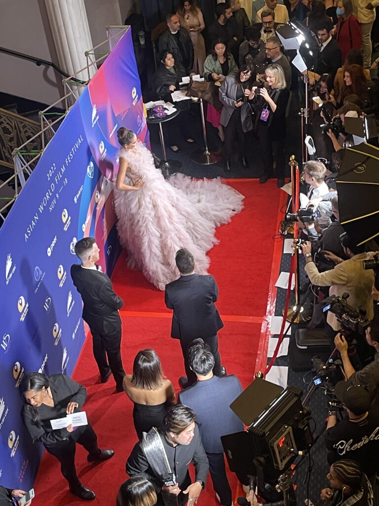 public-figure-protection Two employees from a public figure protection company watching over a celebrity at a red carpet event