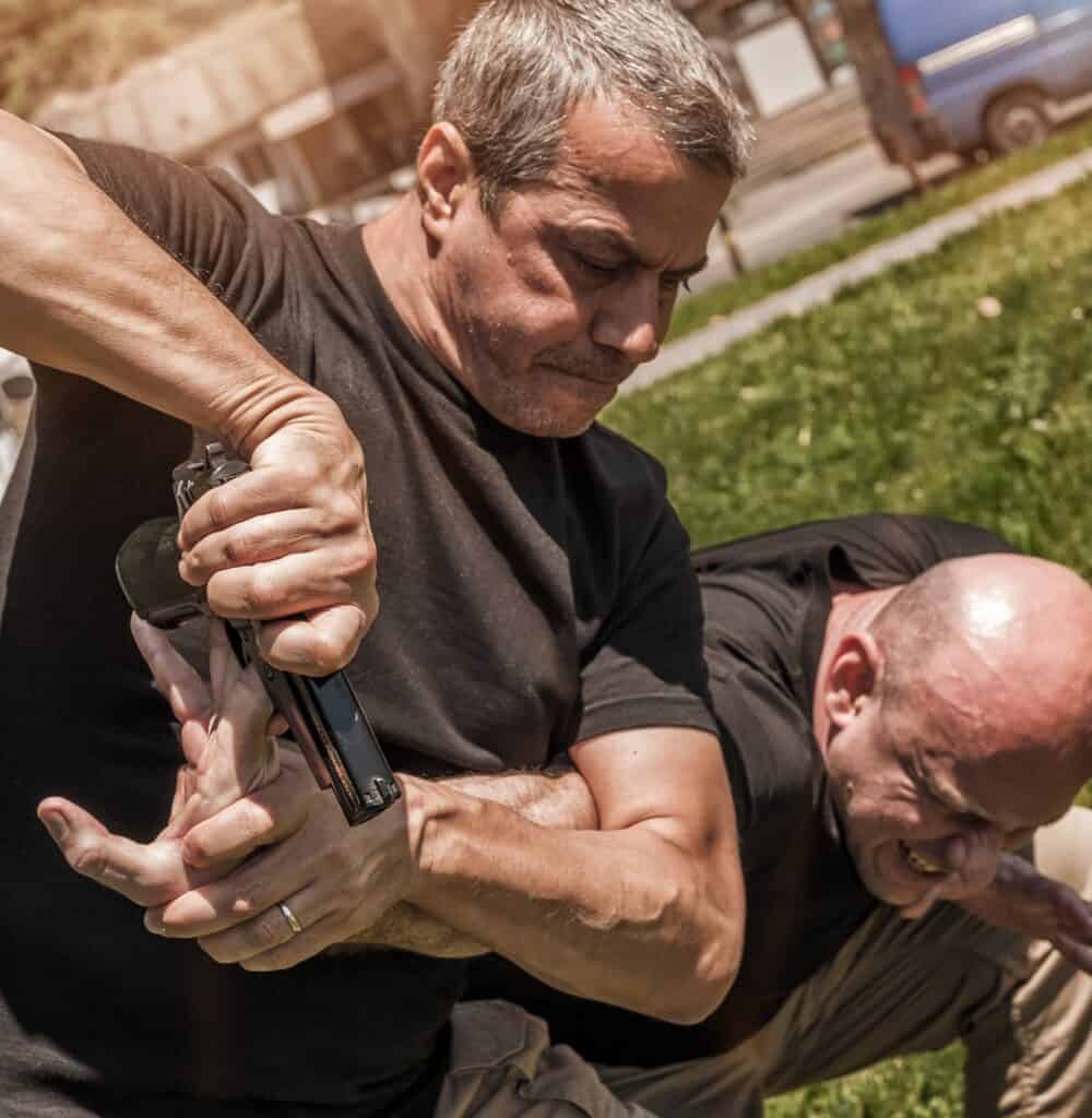 security-disarm A security professional disarming someone