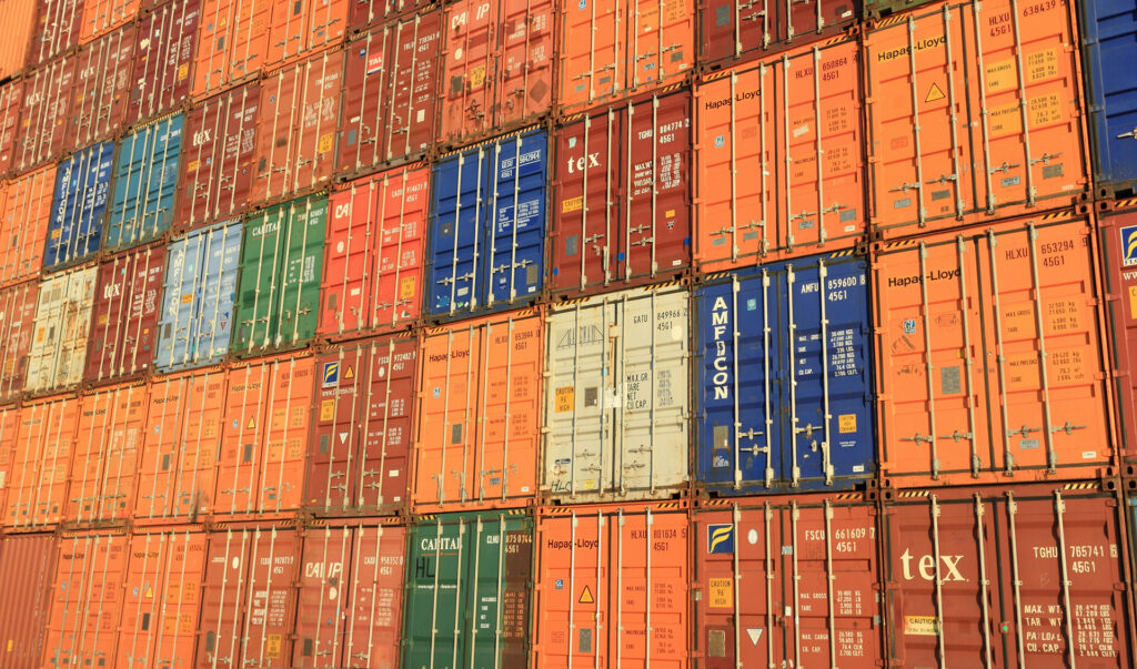 cargo-tracking-services Stacks of shipping containers watched over by cargo tracking services