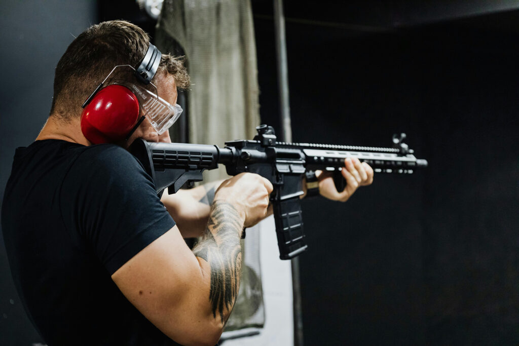 firearms-training-courses A person holding a gun while attending firearms training courses