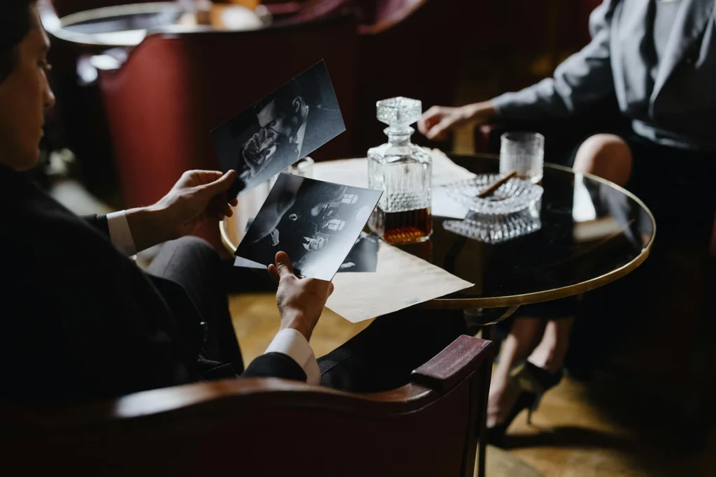 A person conducting lifestyle investigation services showing a person pictures

