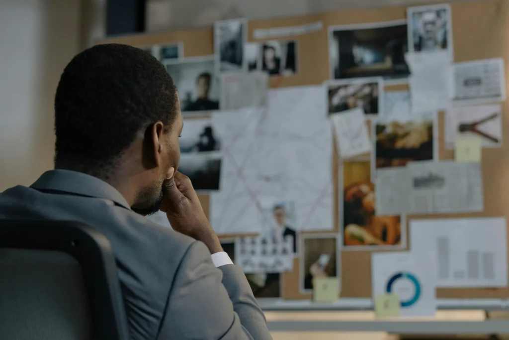 A lifestyle investigator staring at a bulletin board