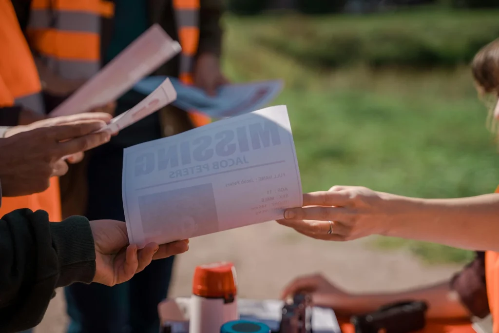 People handing out flyers during missing persons investigations