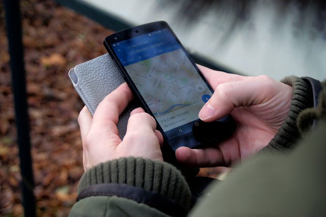 A person using a GPS tracking service on their phone