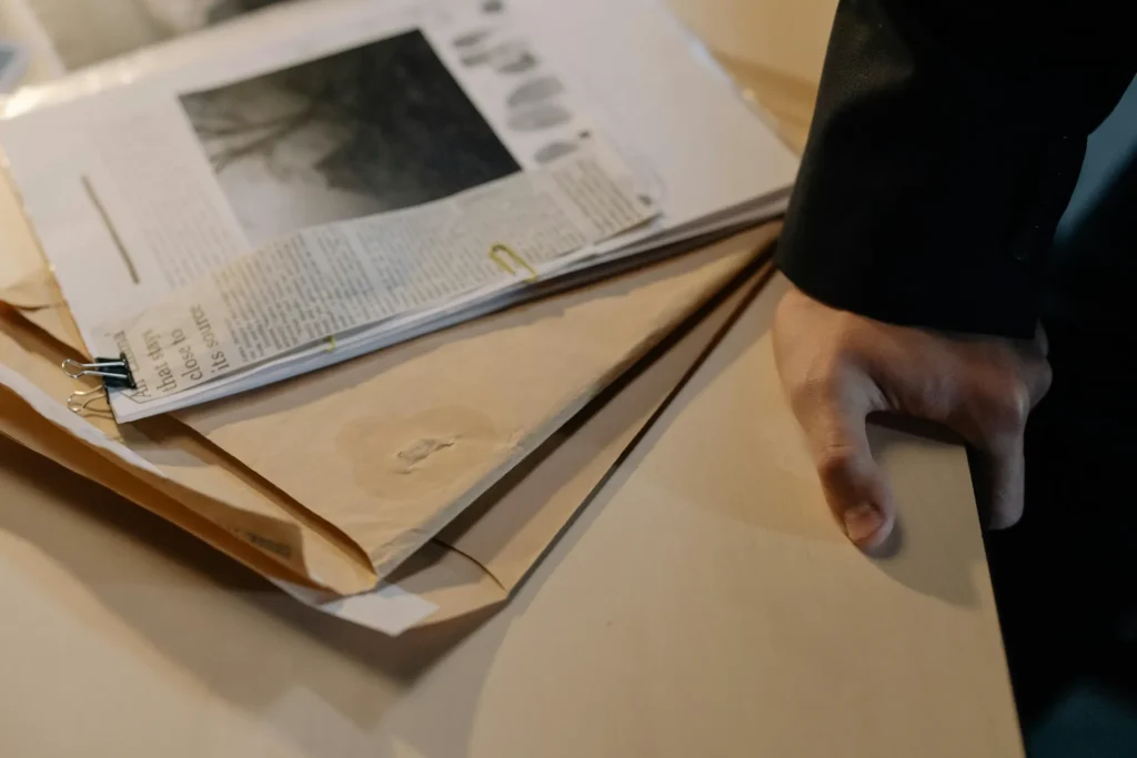 Investigator looking over documents.